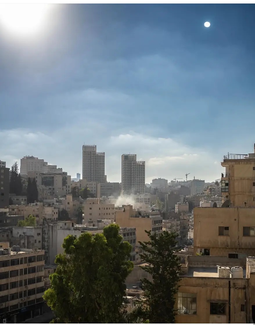 Sunlight over the stone buildings and towers of Amman, Jordan