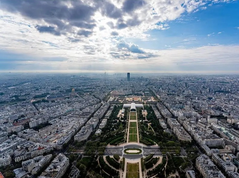 Aerial view over the Champ de Mars and the rooftops of Paris from the Eiffel Tower, France