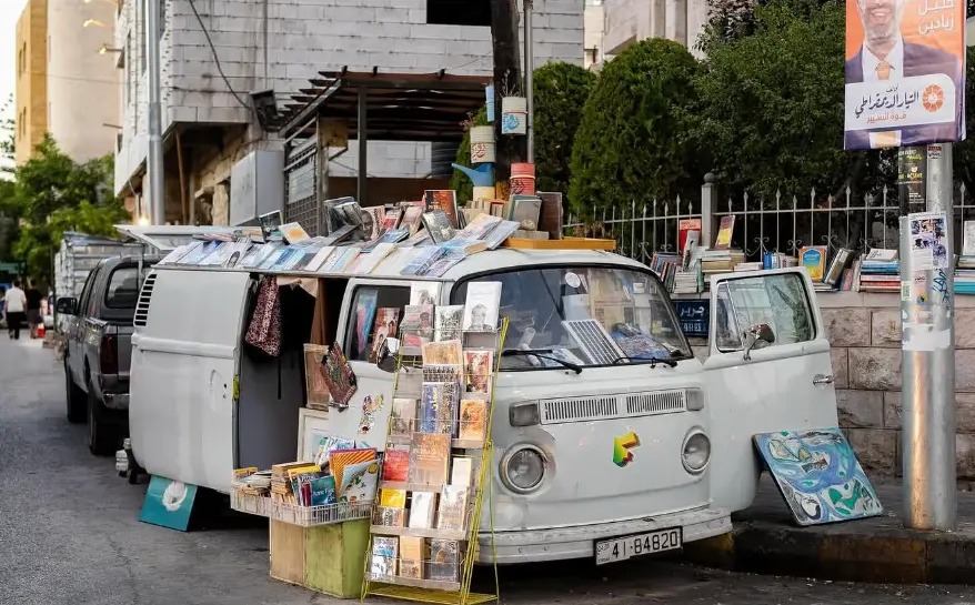 Old van converted into a street bookstall in Al Weibdeh, Amman, Jordan
